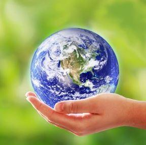 Hand holding a small Earth